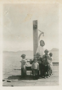 Image of Miriam MacMillan with Eskimo [Inuit] students at MacMillan Moravian School